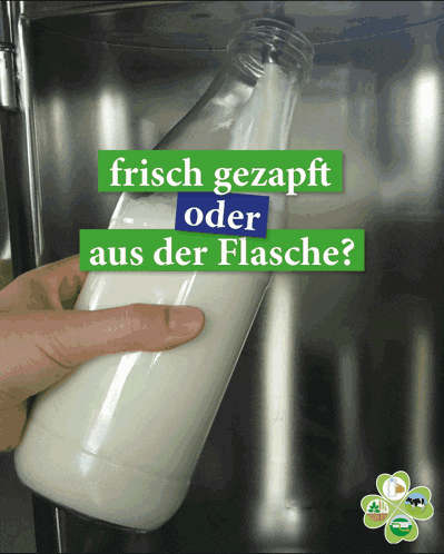 a person holding a bottle of milk with the words " frisch gezapft oder aus der flasche "