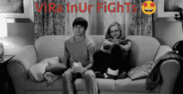 a man and a woman sit on a couch with the words vira inur fights in red