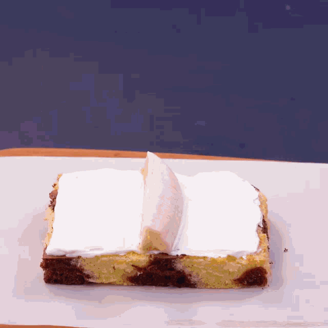 a piece of cake that looks like a book with a banana on top