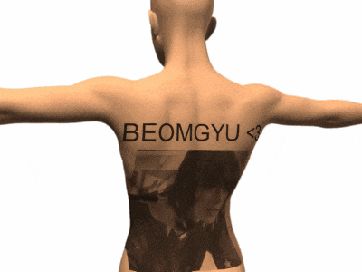 a man has a tattoo on his back that says beomgyu < 3 on it