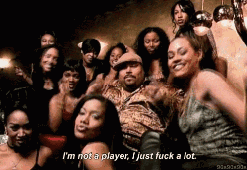 a group of women are standing around a man who says i 'm not a player