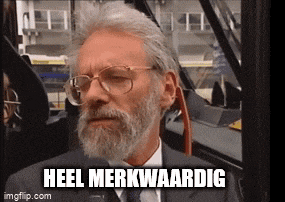 a man with a beard and glasses is sitting on a bus with the caption heel merkwaardig