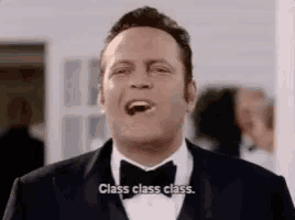 a man in a tuxedo is laughing and saying class class class .