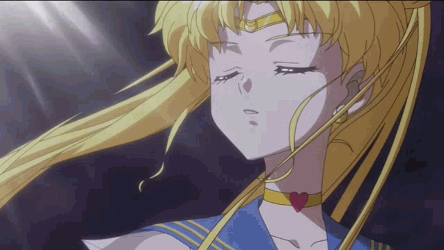 a close up of a sailor moon anime character