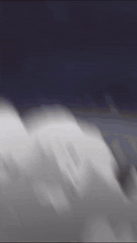 a close up of a person 's face with a blurred background .