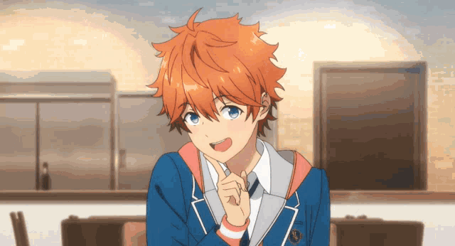 a boy with orange hair and blue eyes is wearing a suit and tie