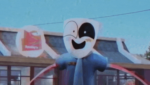 a scarecrow is standing in front of a fast food restaurant .