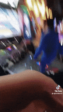 a tiktok video shows a person in a blue suit