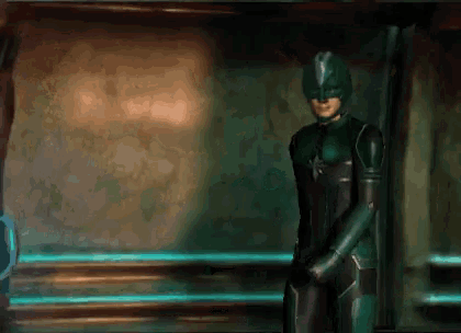 a man in a green superhero suit is standing in a hallway