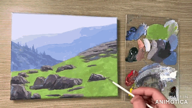 a person is painting a landscape with the words made in animatica visible
