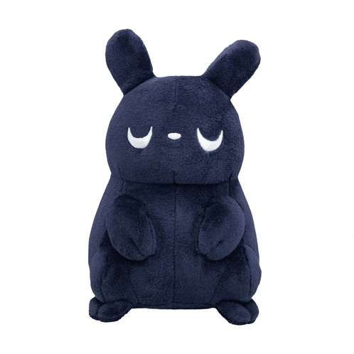a stuffed animal with a crescent moon on it 's face