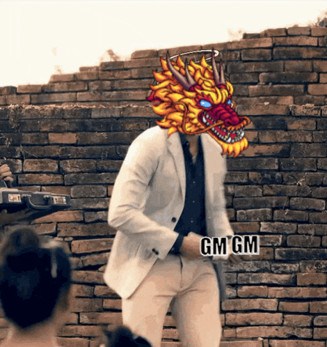 a man in a suit has a dragon head on his head and a gm gm sticker