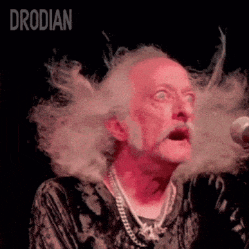 a close up of a man 's face with the word drodian in the corner