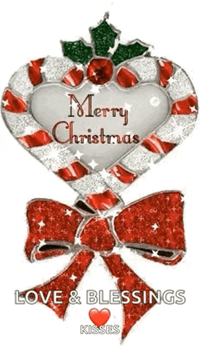 a candy cane in the shape of a heart with a bow and the words `` merry christmas love and blessings kisses '' .