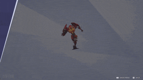 a screenshot of a video game shows a red robot with a shield on its back