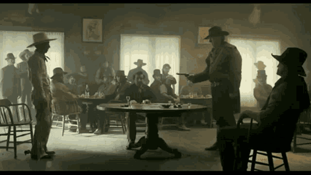 a group of men are sitting around a table in a room with smoke coming out of the windows .