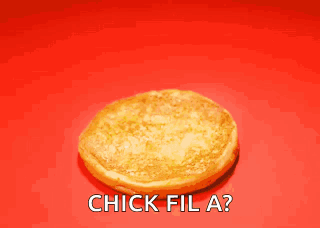 a chick fil a sandwich is on a red background