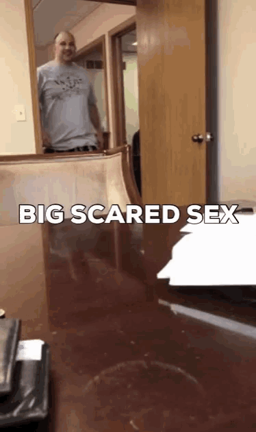 a man standing in front of a mirror with the words big scared sex
