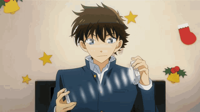 a boy in a blue jacket is holding a card