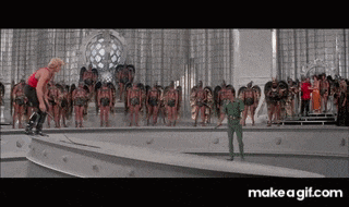 a man is standing on a bridge in front of a group of soldiers .