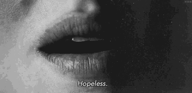 a black and white photo of a woman 's face with the words hopeless written below it