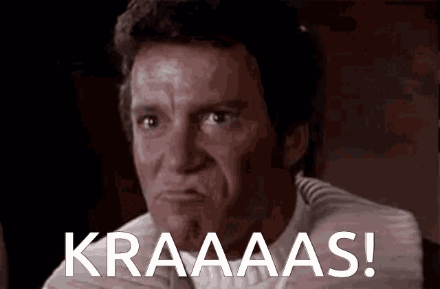 a close up of a man 's face with the words kraaaas written on the bottom