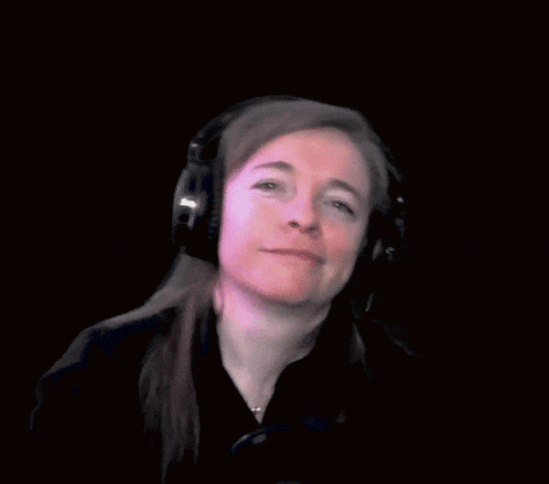 a woman wearing headphones with the word dobranoc on the bottom right