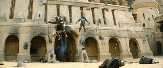 a man is jumping in front of a large building