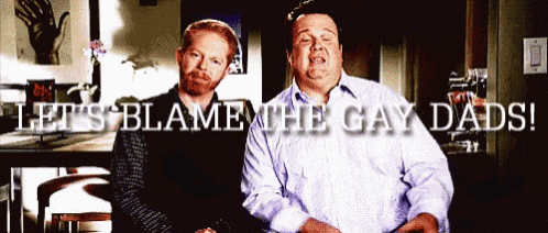 two men are standing next to each other with the words " let 's blame the gay dads " above them