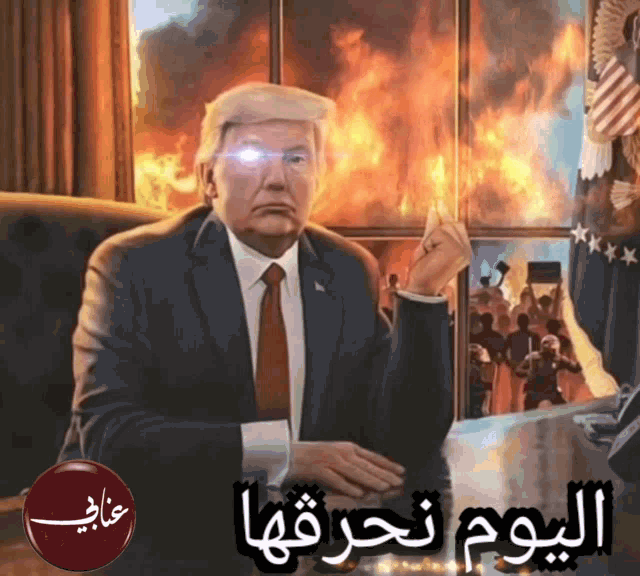 a man in a suit and tie is sitting in front of a burning wall