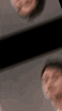 a blurry picture of a person 's face is displayed in a mirror