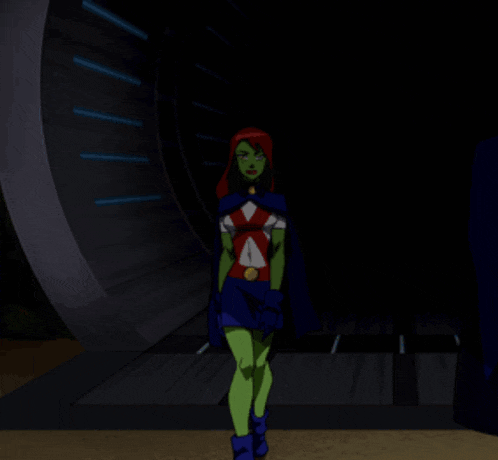 a cartoon character with green arms and red hair stands with her arms crossed