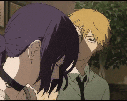 a man and a woman are standing next to each other and looking at each other