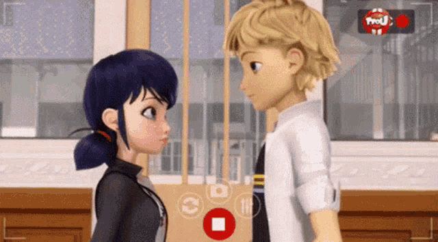 a boy and a girl are looking at each other in front of a camera with a red button that says ' pause '