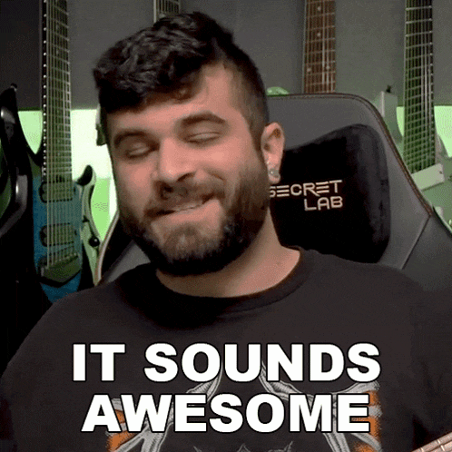 a man with a beard wearing a black shirt that says " it sounds awesome "