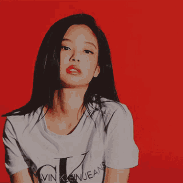 a woman wearing a calvin klein jeans t-shirt