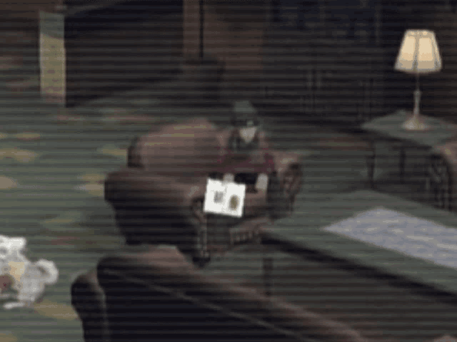 a man sits in a chair in a living room with a book on his lap