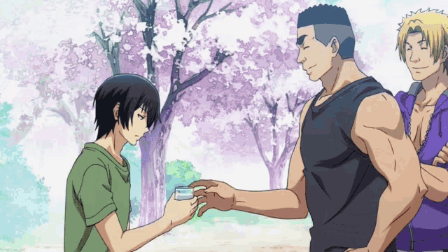 a man is giving a card to another man in a park