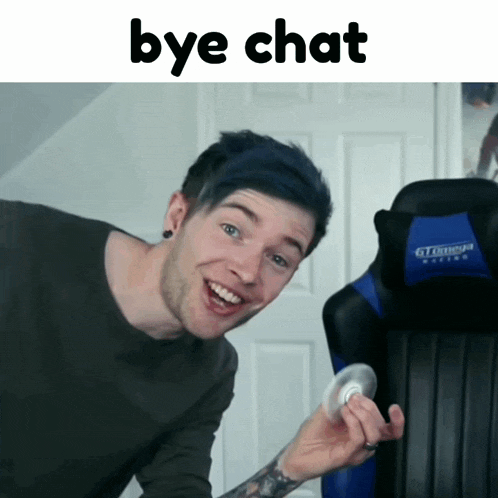 a man with blue hair is holding a fidget spinner in front of a chair that says " bye chat "