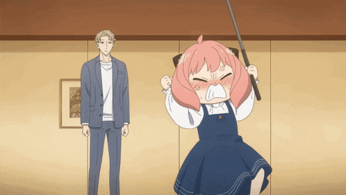 a man in a suit stands next to a girl with pink hair