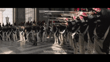 a group of soldiers are lined up in a room with the words " vamos aos votos " written below them