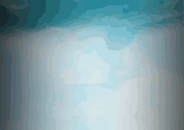 a blue and white background with a few clouds in it