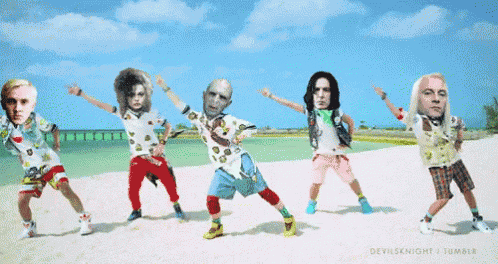 a group of people with faces on them are dancing on a beach ..