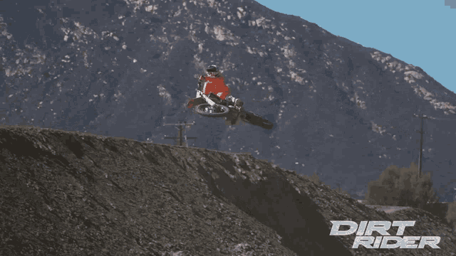 a dirt rider poster shows a person on a dirt bike jumping in the air