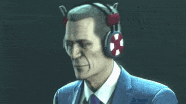 a man in a suit is wearing a pair of headphones with a cross on them