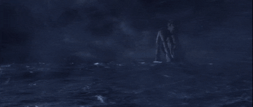 a person is riding a wave in the water