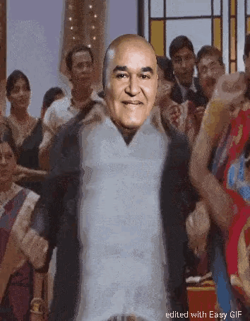 a man with a bald head is standing in front of a crowd of people with the caption edited with easy gif