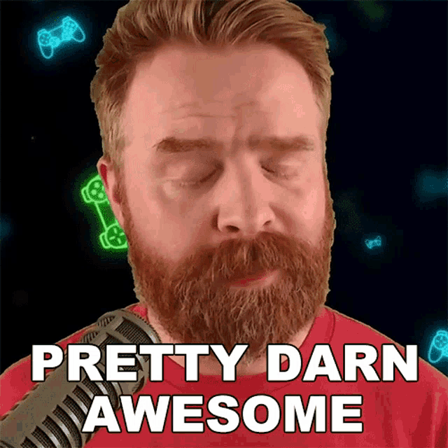 a man with a beard is standing in front of a microphone and says pretty darn awesome
