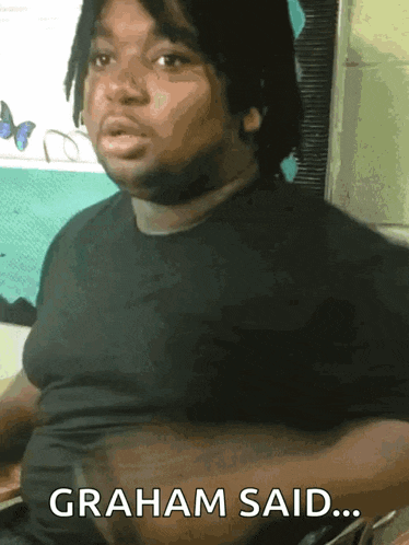 a man in a black shirt has graham said on his chest