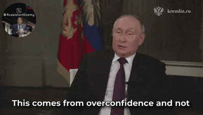 a man in a suit and tie says " this comes from overconfidence and not " in front of a russian flag